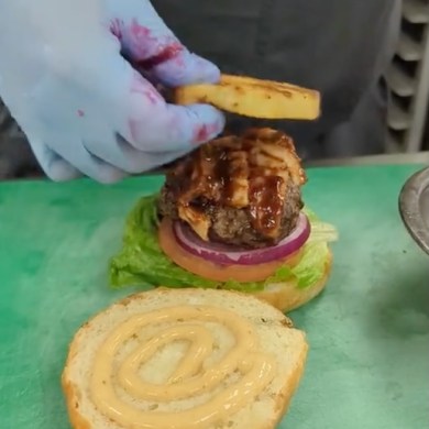 A Copperhouse burger is prepared.